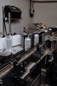 A canning machine on an assembly line